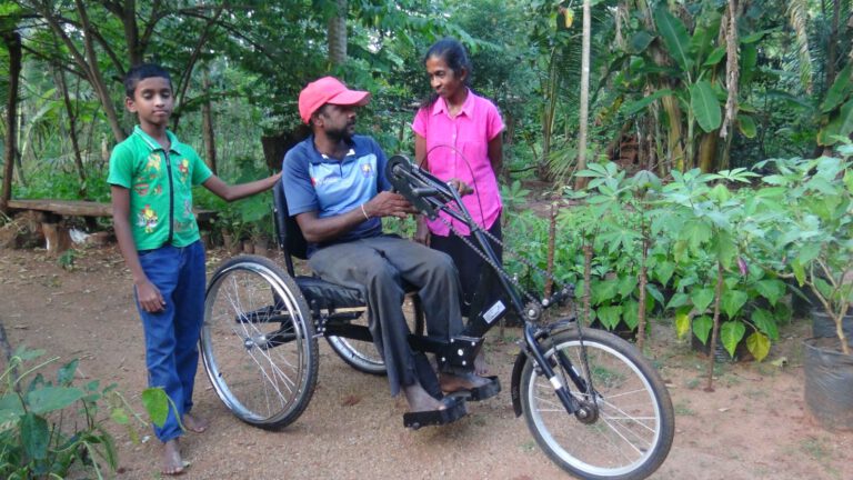Donation of wheel chair and cash donation
